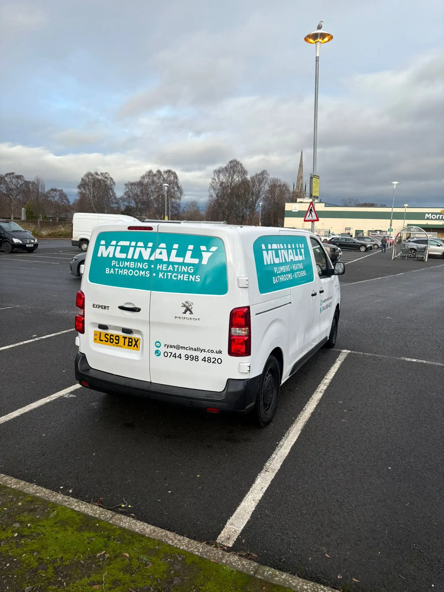 Ryan McInally beside his plumbing van in Edinburgh